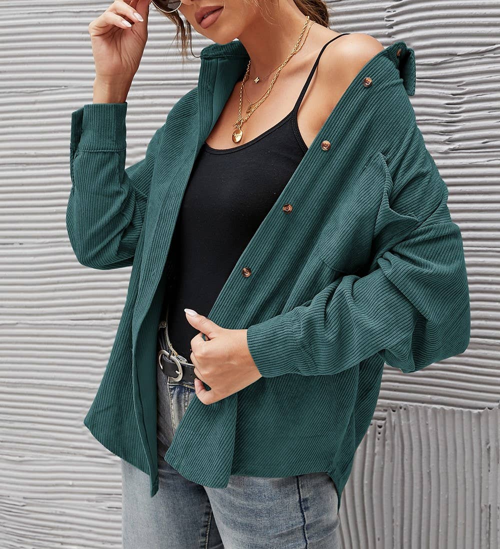 Forest green corduroy oversized shacket with a solid design, providing a trendy and comfortable oversized fit.