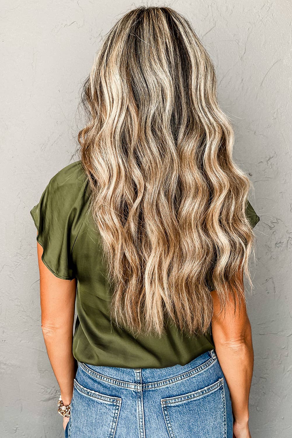 olive green back view of Elegant satin top with pleated detail and flutter sleeves, offering a sleek, luxurious look and versatile styling options.