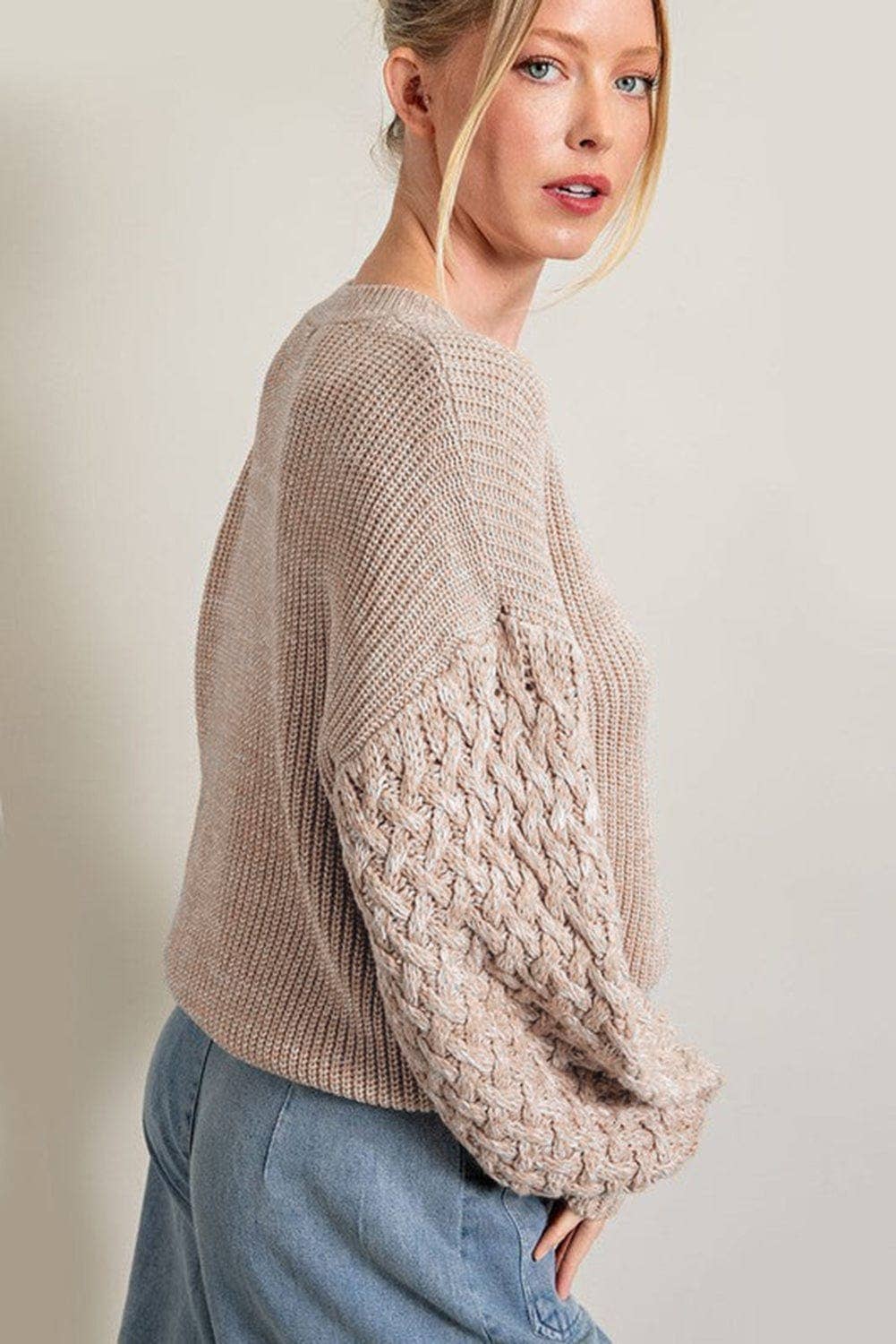 side view of Madelynne Chunky Knit Sweater in Parchment, featuring a drop shoulder design and chunky knit texture.