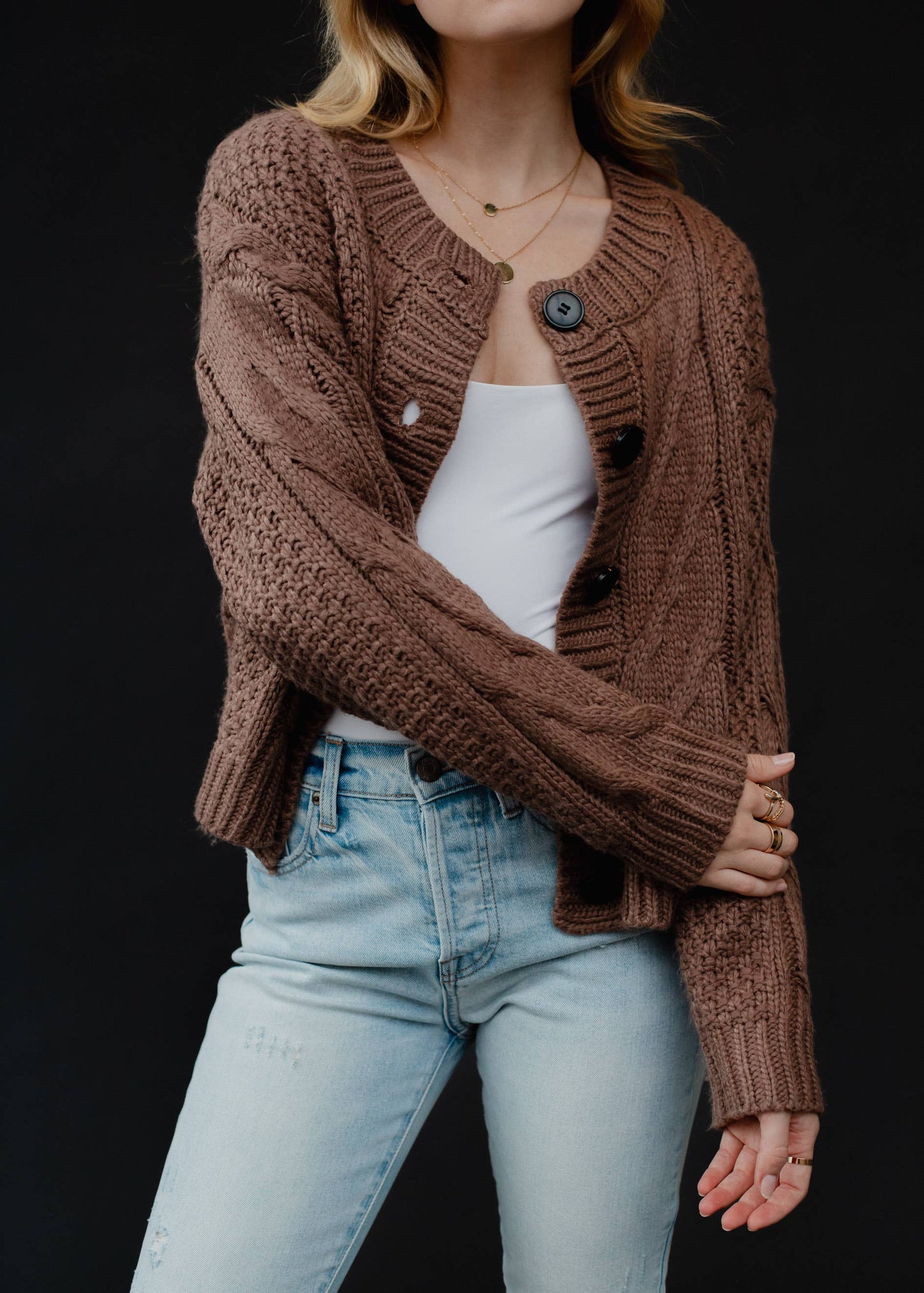 cross arm open front view of Brown Cropped Cardigan with Button Closure and Cable Knit Design