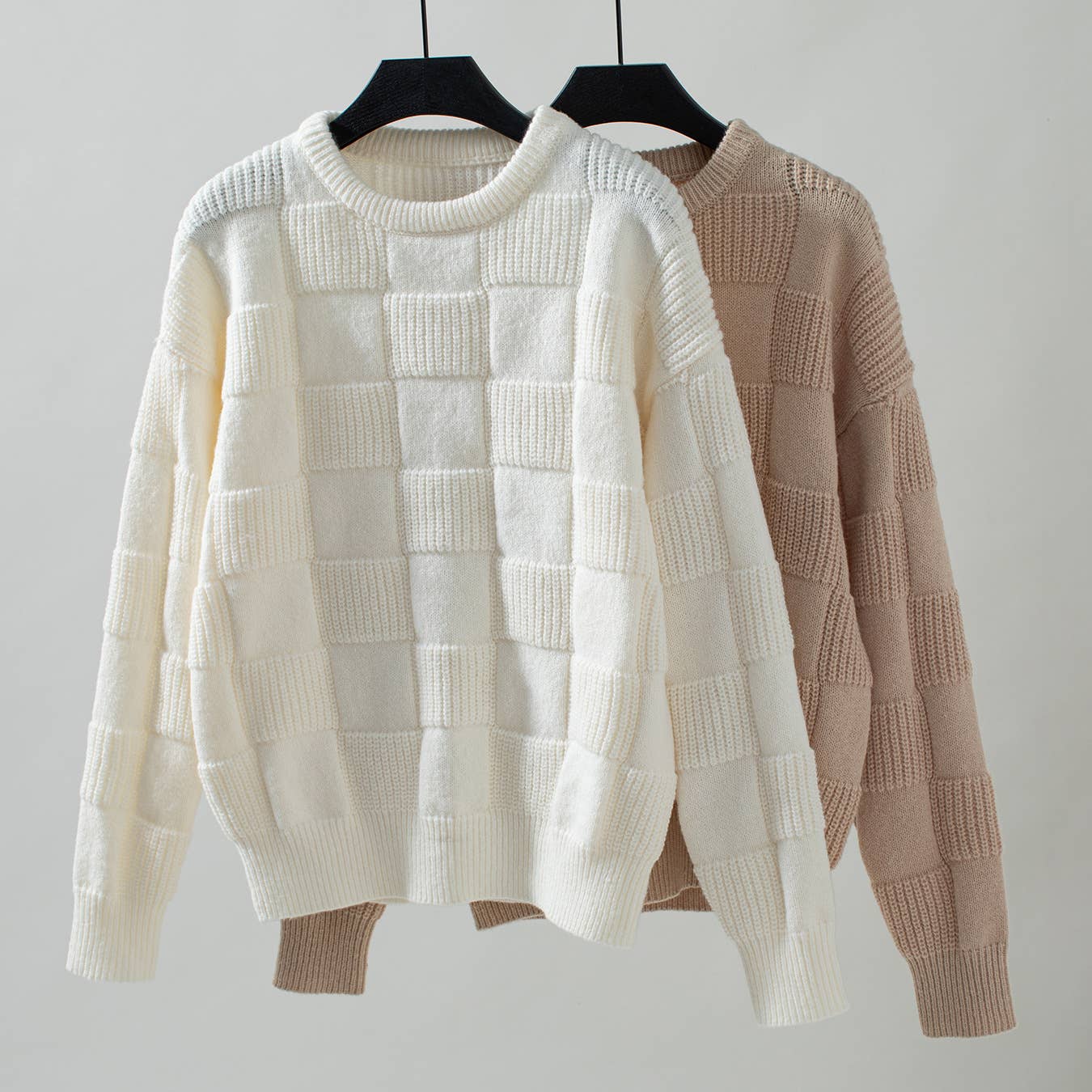 multiple view of Apricot minimalist checked crewneck sweater featuring a subtle checked pattern and a comfortable, stylish fit.