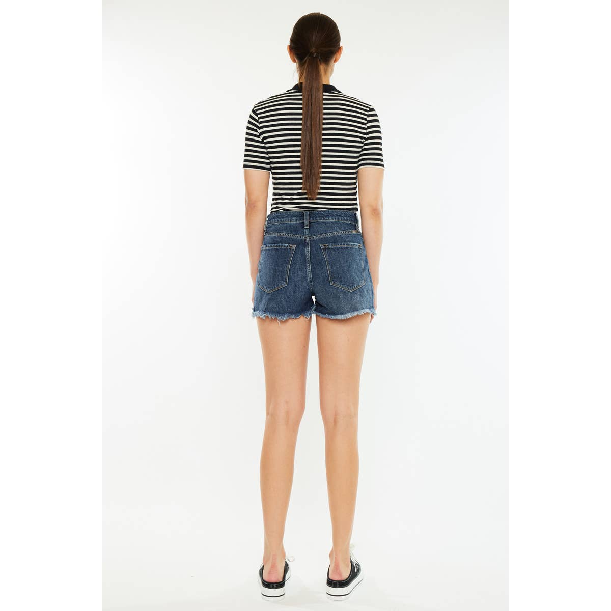 back view of Kan Can USA high rise mom shorts with dark stone wash and raw frayed hem
