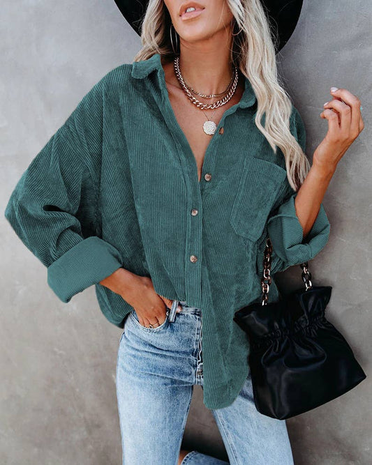 Forest green corduroy oversized shacket with a solid design, providing a trendy and comfortable oversized fit.