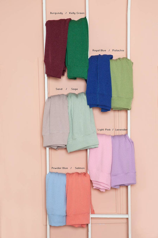 multiple view of Sage wave rib short sleeve crop top with a front tie and pocket, made from supersoft material, offering a loose fit and vibrant look.