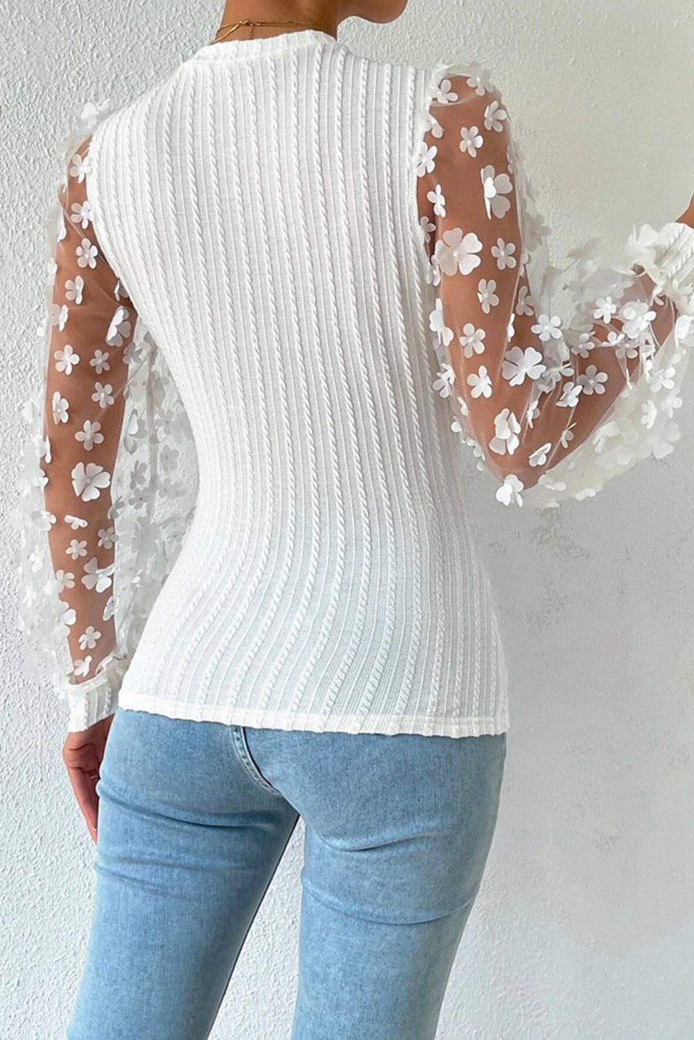 back view of white Textured knit blouse with floral applique mesh sleeves, crew neck, and elegant detailing for a chic and sophisticated look.
