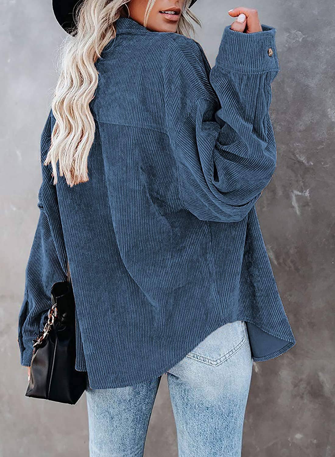 Navy corduroy oversized shacket with a solid design, offering a cozy and stylish oversized fit.