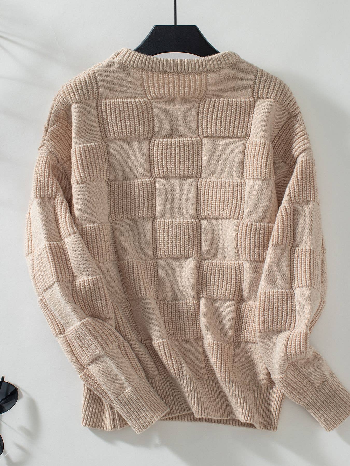 back view of Apricot minimalist checked crewneck sweater featuring a subtle checked pattern and a comfortable, stylish fit.