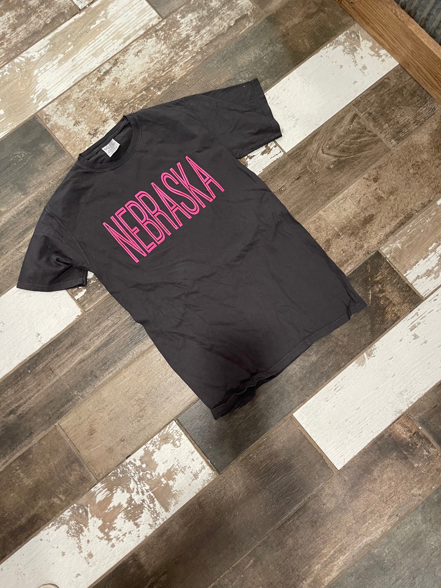 Neon pink puff screen print state tee on Comfort Color pepper shirt