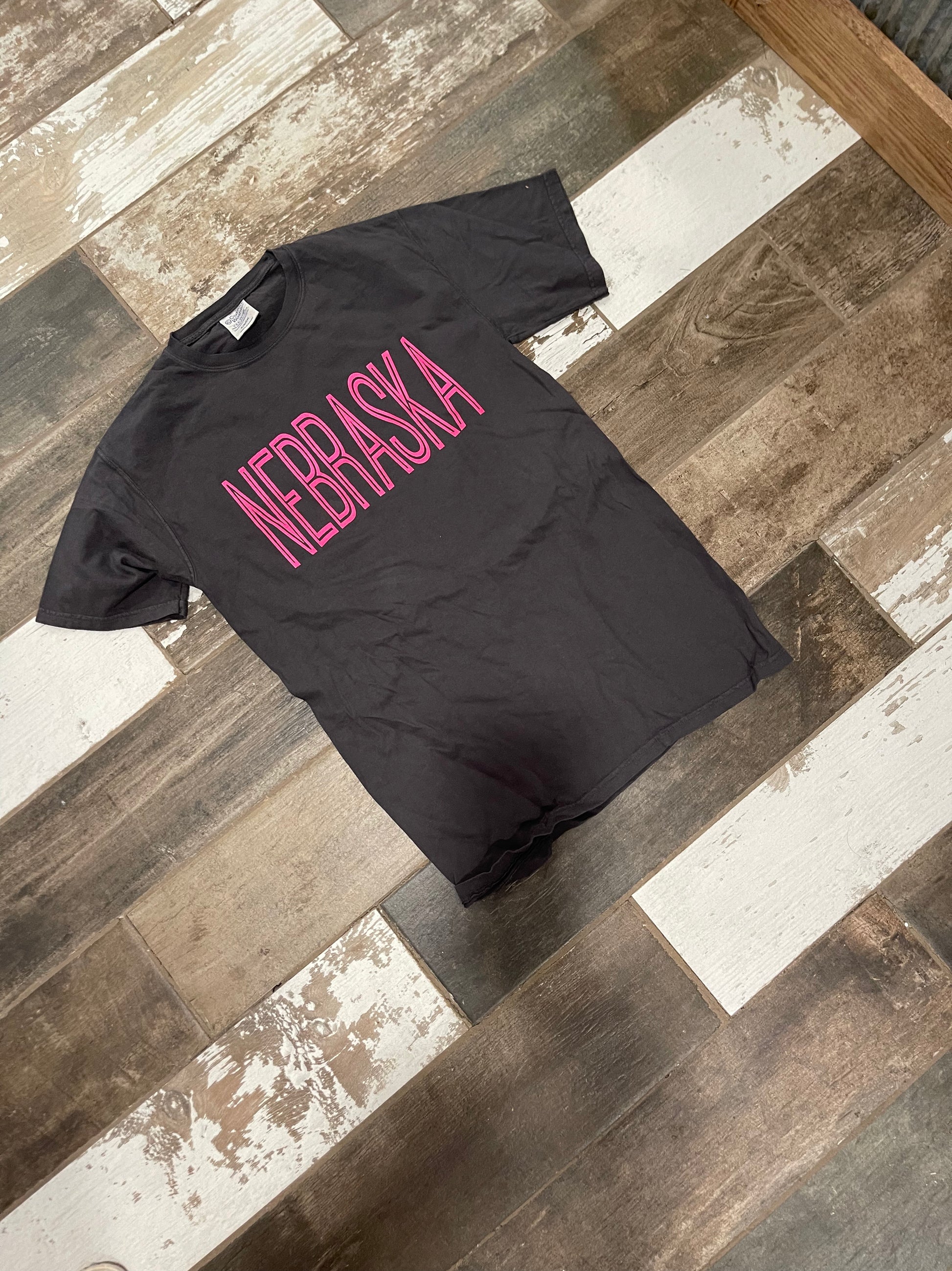 Neon pink puff screen print state tee on Comfort Color pepper shirt