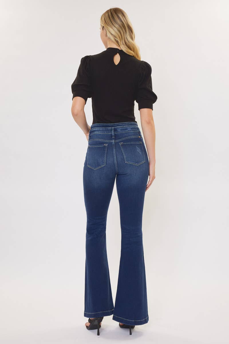 back view of Kan Can High Rise WB Detail Curvy Flare Jeans in Dark Stone Wash with comfort stretch fabric, button fly, and non-distressed open pack flare design. Features an 11" rise and 33" inseam, made from 95% cotton, 4% polyester, and 1% Lycra.