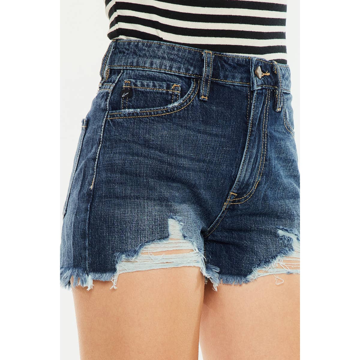 zoomed in side view of Kan Can USA high rise mom shorts with dark stone wash and raw frayed hem