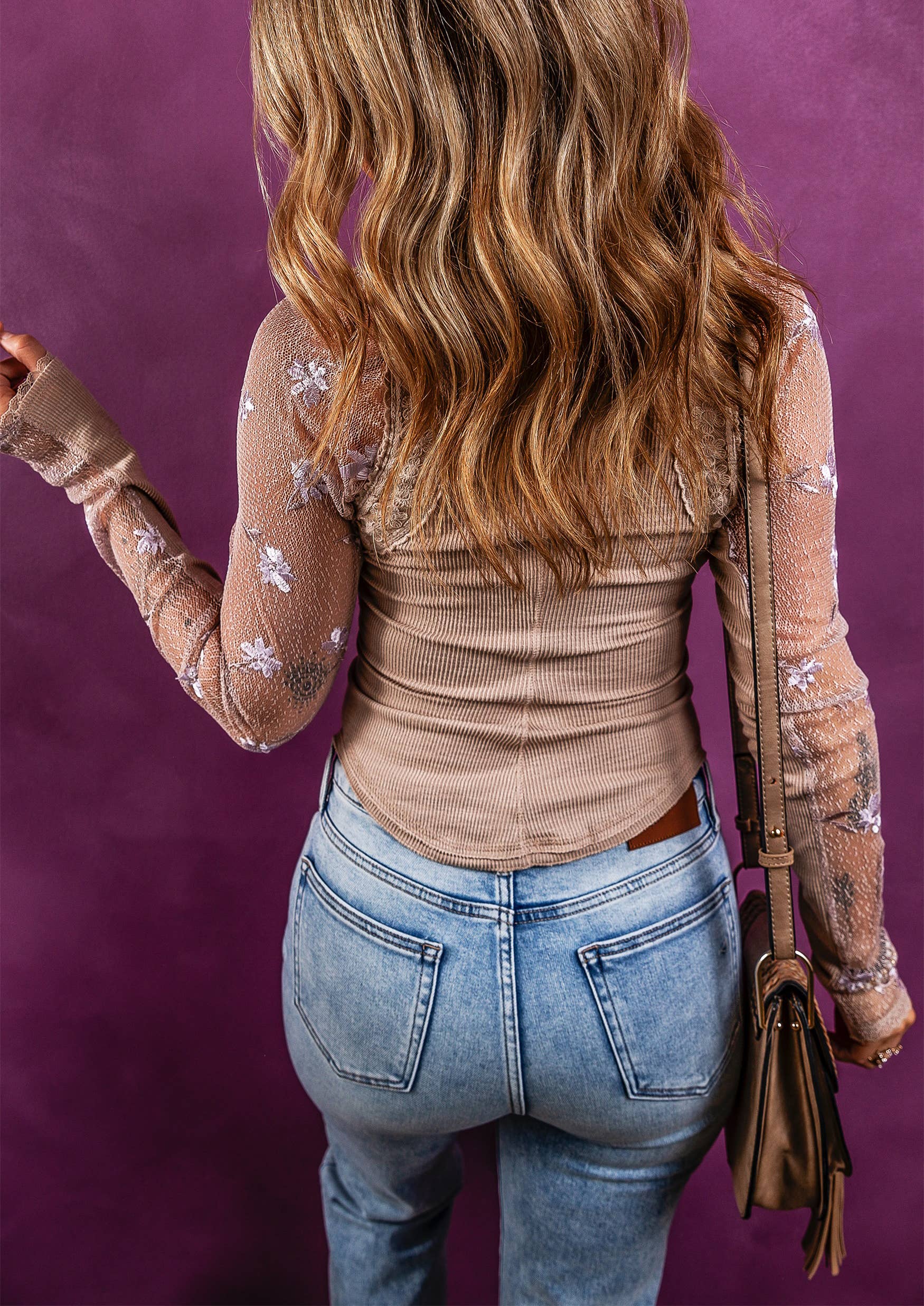 back view of Ribbed knit top with floral gauze sleeves and a patchwork design, offering a feminine and unique look for any occasion.