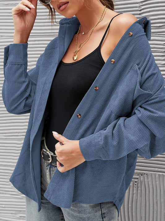 Navy corduroy oversized shacket with a solid design, offering a cozy and stylish oversized fit.
