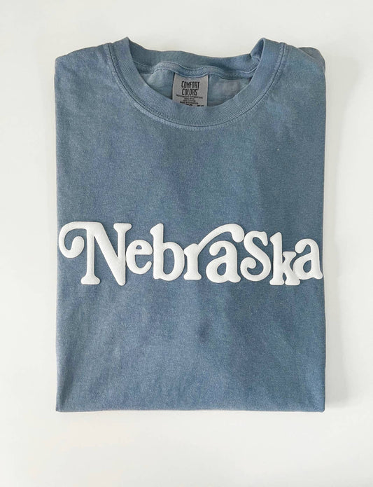 Nebraska Puff T-Shirt with white puff lettering on Comfort Colors pigment dyed tee