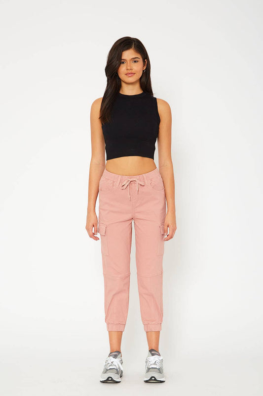 Monkey Ride High-Rise Mauve Jogger Jeans with an elastic drawstring waistband, elastic ankle cuffs, and four-pocket detailing. Capri length with a front rise of 10.5", inseam of 24", and leg opening of 5.25".