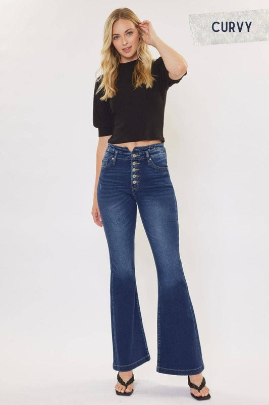 Kan Can High Rise WB Detail Curvy Flare Jeans in Dark Stone Wash with comfort stretch fabric, button fly, and non-distressed open pack flare design. Features an 11" rise and 33" inseam, made from 95% cotton, 4% polyester, and 1% Lycra.