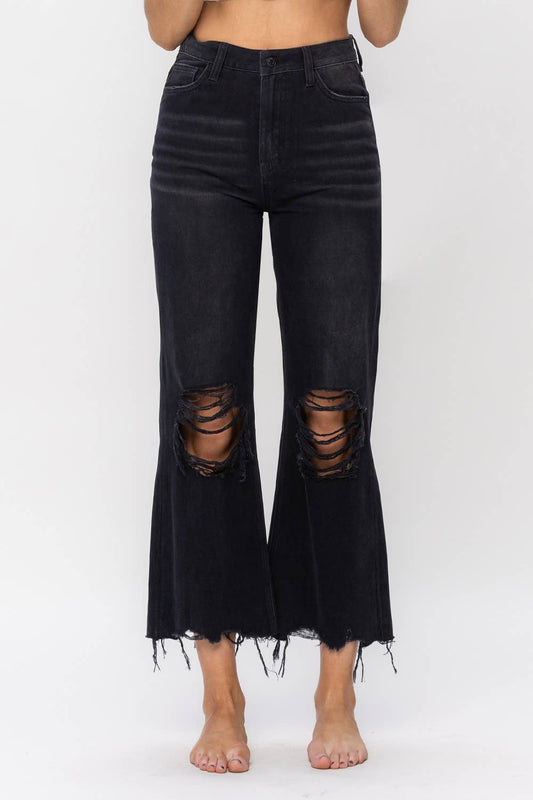 Vervet by Flying Monkey 90s Vintage Crop Flare Jeans, showcasing non-stretch denim with distressed details, high waist, relaxed legs, and a cropped flare design. Front rise of 11.5", inseam of 27", and leg opening of 20". Model is 5'9" wearing size 26.
